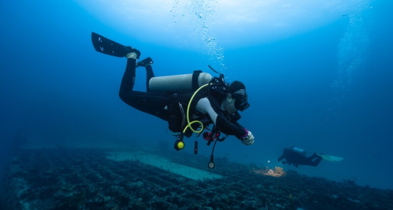 female diver practicing deep diving skills